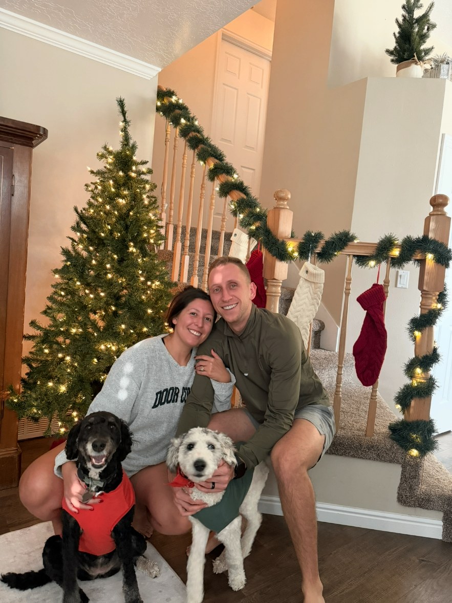 Melanie's family and their two dogs together outdoors
